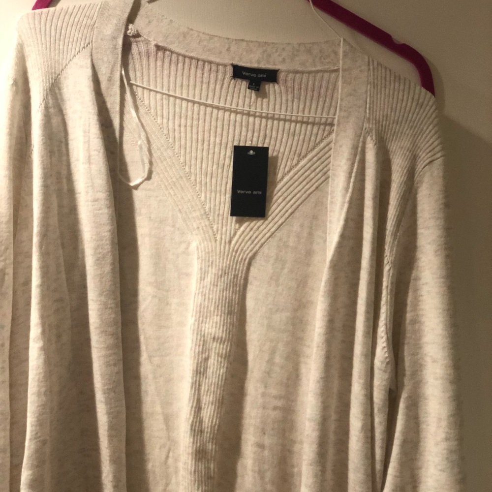 Never worn. cream pink green sweater